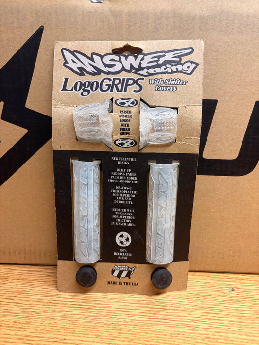 Clear Answer Racing eBike grips displayed against a white background, showing textured surface and ergonomic design.
