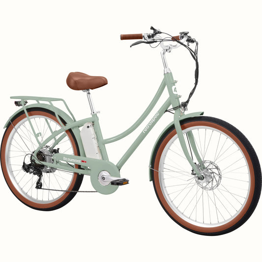 Retrospec Beaumont Rev 3 electric bike in mint green, side view, with step-through frame, rear rack, and brown saddle and grips.