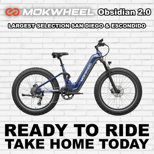 Blue and grey Mokwheel Obsidian 2.0 ST electric bike, side view, against a white background.