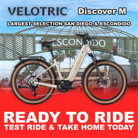 Platinum silver Velotric Discover M eBike in large size, shown fully assembled and ready to ride, side view against a plain background.