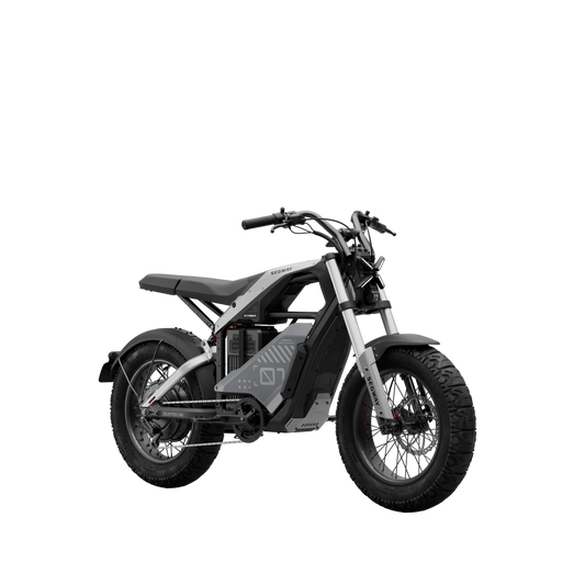 Side view of the eMOTO Segway Xyber electric bike in a studio setting, showcasing its rugged frame, large tires, and modern design features.