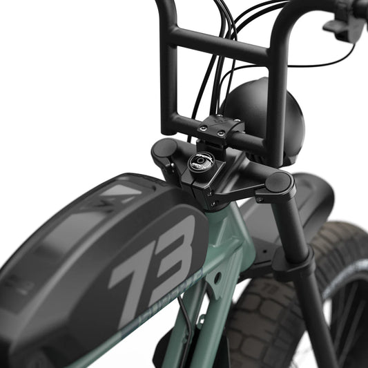 Side view of the Super73 S2 Laguna electric bike in a coastal setting, highlighting its sleek frame, wide tires, and modern design.