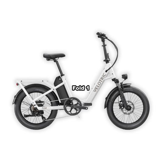 Velotric Fold 1 eBike in pearl white, folded and placed inside its box, product image on white background.