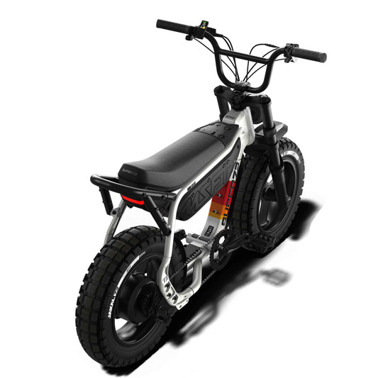 Side view of the eMOTO eBike Super73 MZFT SE in a showroom, highlighting its black frame, thick tires, and minimalist design.
