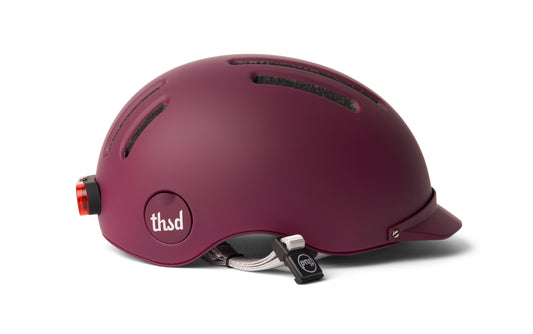 A black MIPS bicycle helmet with a sleek aerodynamic design, multiple ventilation holes, and an adjustable chin strap, displayed on a white background.