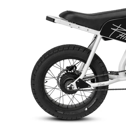 Electric mountain bike, eBike Strike Rhino, side view, black and red frame, thick tires, outdoor background