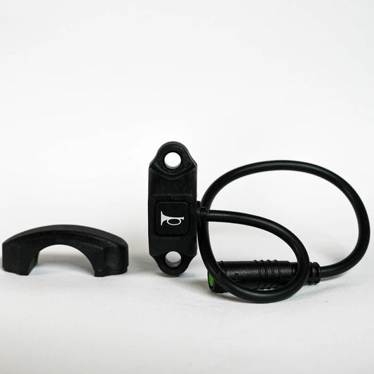 Close-up of a black eBike horn switch designed for Super73, featuring a compact rectangular button with wiring attached.