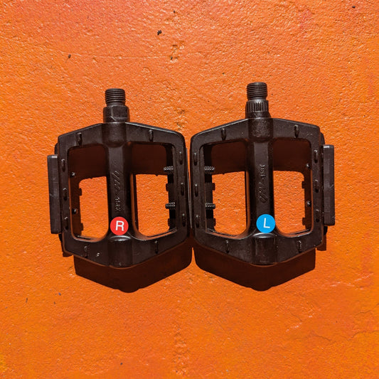 Close-up view of metal eBike pedals in Style 2, featuring a textured surface and sturdy construction, designed for enhanced grip and durability.