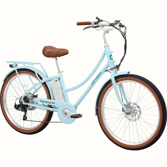 Retrospec Beaumont Rev 3 eBike in Larimar color, side view, showing step-through frame, rear rack, and front basket