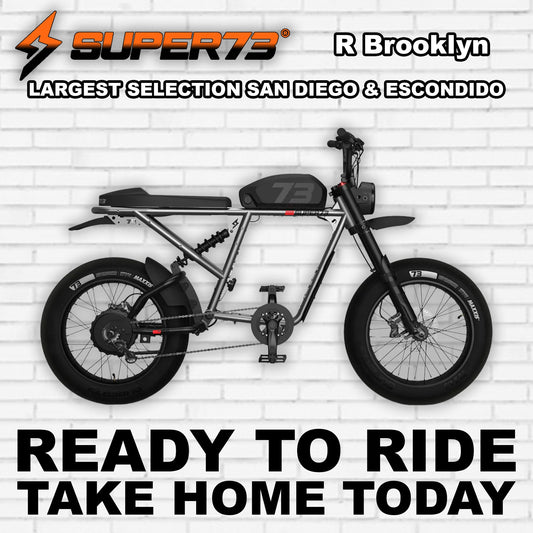 Super73 R Brooklyn electric bike in metallic aluminum finish, side view, displayed on a white background