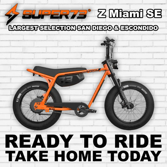 Super73 Z Miami SE electric bike in Astro Orange, side view, isolated on white background