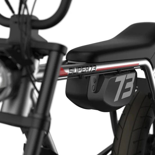 Side view of the Super73 ZX Core Legacy Series eBike in metallic aluminum, showcasing its sleek frame, wide tires, and minimalist design against a plain background.