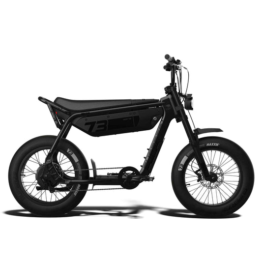 Super73 B1G SE eMOTO eBike in Blackout color, shown in its original box with packaging materials.