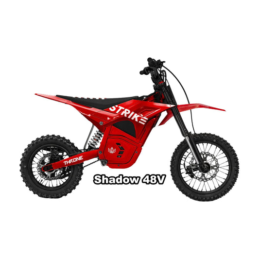Red eMOTO Strike Shadow 48V electric bike in its original packaging box, partially visible with branding and product details on the box.