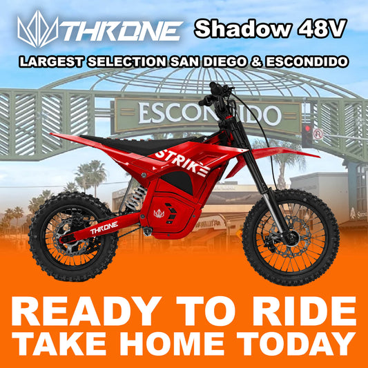 Red eMOTO Strike Shadow 48V electric motorcycle, side view, on a white background