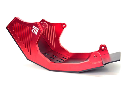 Red eMOTO Heavy Hitter Surron V2 skid plate, angled view, showing durable construction and mounting points.