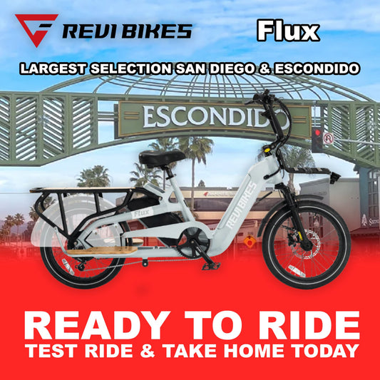 Gray eBike Revi Flux electric bicycle side view with black tires and sleek frame design