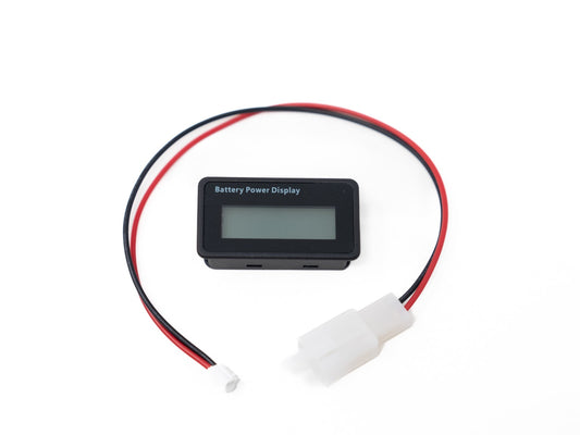 Stomp Ebox 60V battery indicator showing charge level on digital display, mounted on electric bike handlebars.