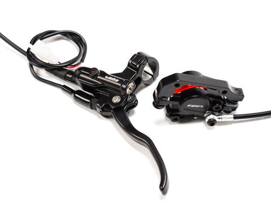 Stomp Ebox rear brake complete system showing brake caliper, disc, master cylinder, and connecting brake line on a white background.