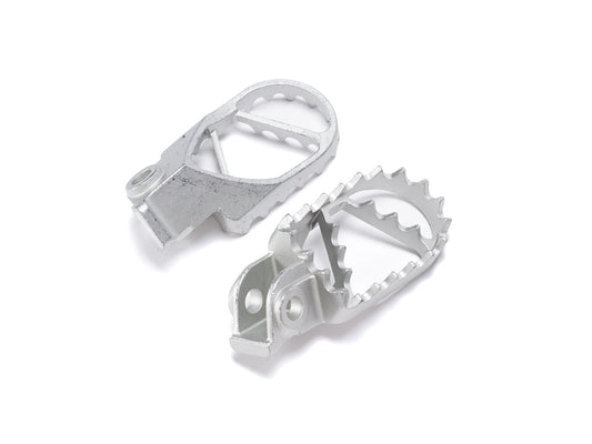Stomp Ebox stainless steel foot peg kit displayed on a white background, showing two metal foot pegs with a textured surface and mounting hardware.
