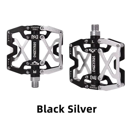 Close-up of MZYRH aluminum eBike pedals in black and silver, showing the pedal's textured surface and durable metal construction.
