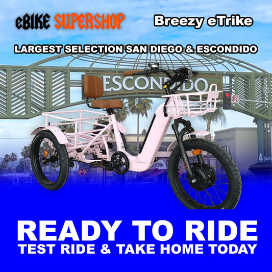 Pink eBike Breezy electric trike, ready to ride, side view against a plain background