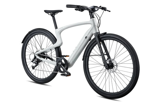 Side view of the Urtopia Carbon 1 Pro eBike in creme color, showcasing its lightweight carbon frame, sleek design, and integrated display on the handlebars.
