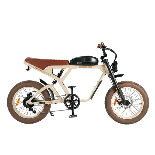 Side view of the eMOTO eBike Revi Cougar Pro in sand color, showcasing its sturdy frame, fat tires, and integrated battery on a plain background.