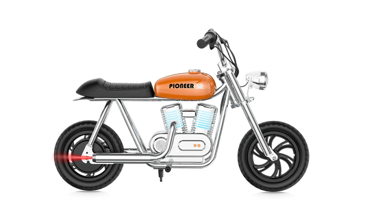 Orange eMOTO Hyper Gogo Pioneer 12 Plus electric bike without training wheels, shown in profile view, with app connectivity features.