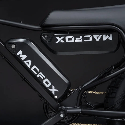 Side view of the Macfox X7 eBike in a studio setting, showcasing its sturdy frame, large tires, and modern design features.