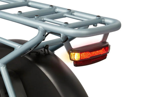 A white RADIO FLYER Via Pro 750w Step Thru electric cargo eBike with 24x2.4 street tires, shown from the side against a plain background.