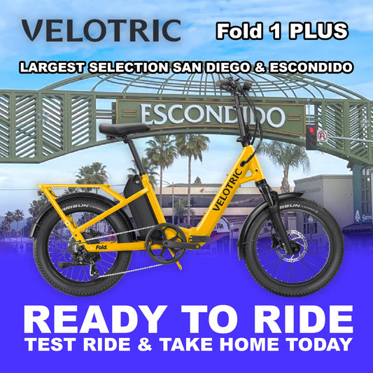 Velotric Fold 1 PLUS eBike in Mango color, fully assembled and ready to ride, side view against a plain background
