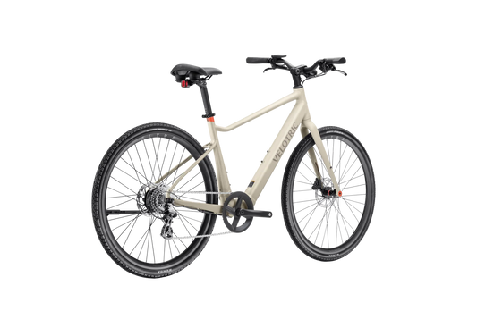 A sleek Velotric T1 ST Plus eBike in a studio setting, showcasing its lightweight frame, integrated battery, and modern design.