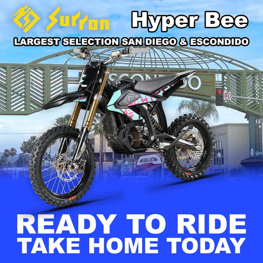Blue eMOTO Surron Hyper Bee electric bike, ready to ride, side view, product image