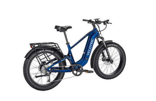 Royal blue Velotric Nomad 2X High Step eBike, side view, against a plain background
