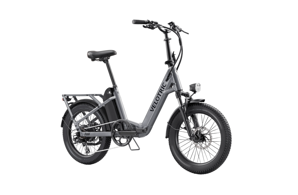 Velotric Fold 1 eBike in Stone Gray, side view, folded for compact storage