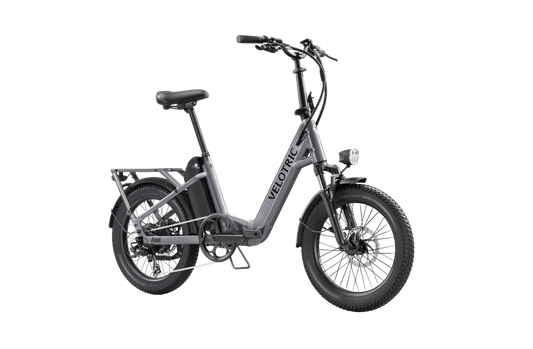 Velotric Fold 1 eBike in Stone Gray, side view, folded for compact storage