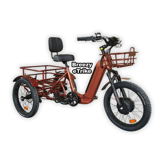 Copper-colored eBike Breezy Electric Trike shown in its original packaging box