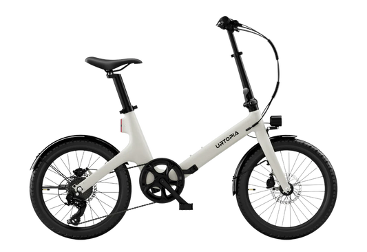 Urtopia Carbon Fold Step Thru eBike in creme color, shown folded with lightweight carbon frame and step-through design.