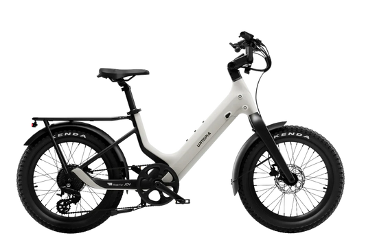 Urtopia Carbon Joy Ultra eBike in creme color, side view, showcasing lightweight carbon frame and modern design.