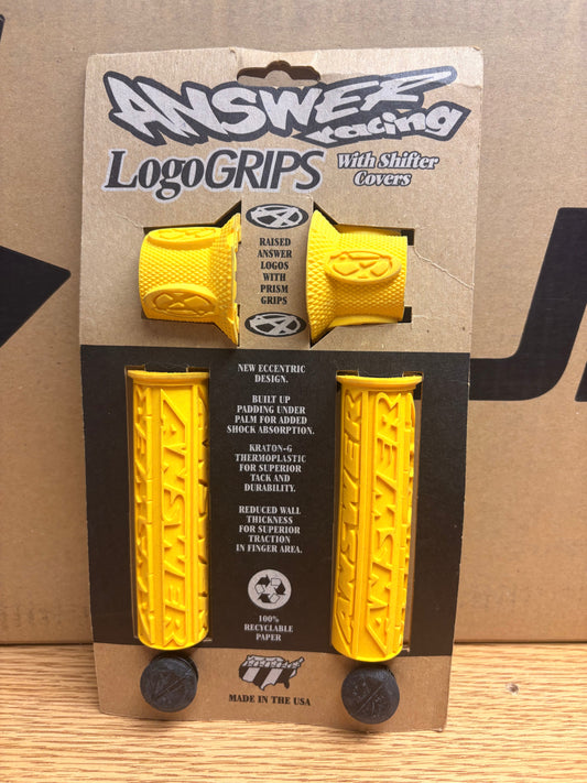 Yellow Answer Racing eBike grips, textured surface, displayed on a white background.