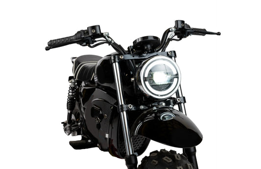 A black eBike Drift Hero 1500W Mini electric bike with thick tires, a compact frame, and a padded seat, shown from a side angle on a white background.