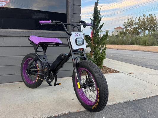 Black and purple eMOTO eBike Macfox X1S CUSTOM, ready to ride, side view against a plain background.