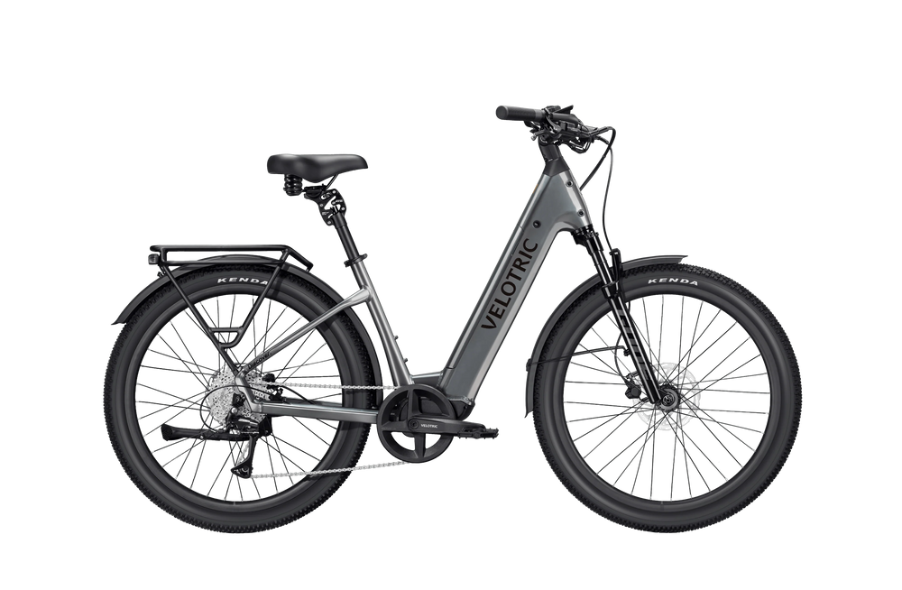 Stone gray Velotric Discover 3 eBike side view, showcasing frame design, battery placement, and wheels against a plain background.