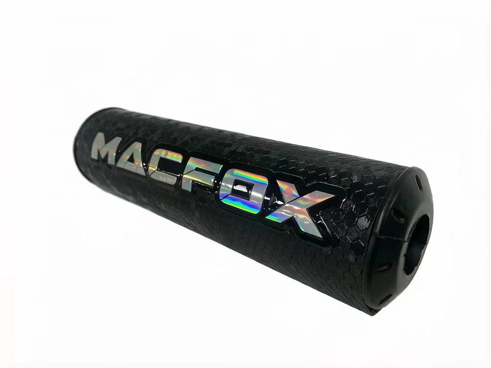 A black Macfox universal eBike bar pad with white logo, shown mounted on handlebars.