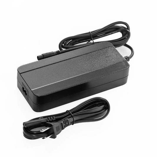 Super73 eBike charger, 54.6V 3A, black rectangular unit with attached power cord, shown from an angled side view.