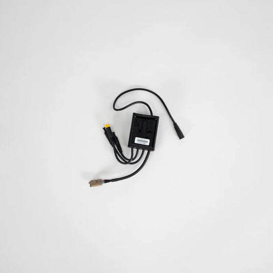 Product image of the eBike Converter - Super73 DCDC Converter Version 1, showing a compact electronic module with wiring connectors and labeled components.