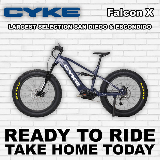 Dark blue eBike Cyke Falcon X electric bicycle, side view, against a plain background.