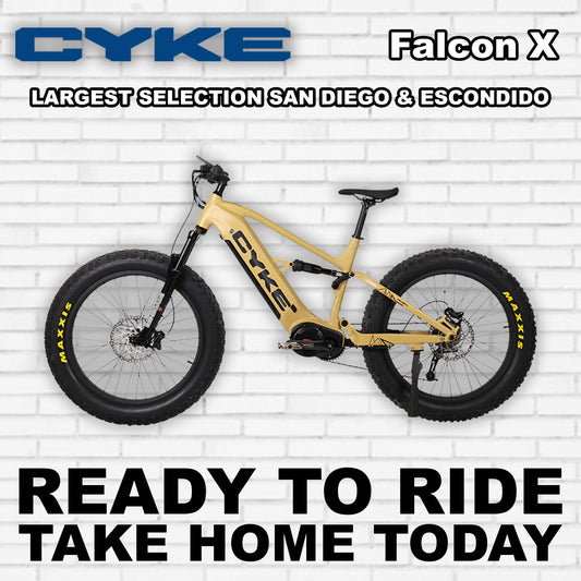 Desert yellow eBike Cyke Falcon X electric bicycle, side view, against a neutral background.