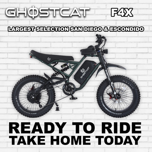 Army green eBike Ghostcat F4X, side view, rugged design, thick tires, outdoor background